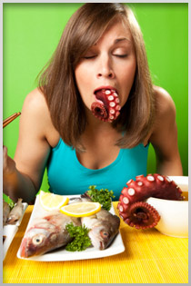 Woman gagging on an octopus tenticle