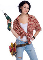 Cute girl wearing tool belt holding a drill