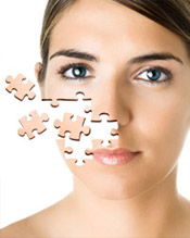 Woman whose face is breaking off into pieces of a puzzle