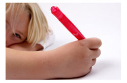 Child writing with a marker