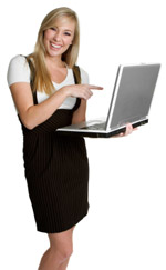 A woman giggling at her laptop