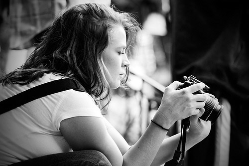 Photographer reviewing images on her camera